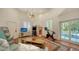 Fun game room features exercise bike, arcade games, and a view of the pool at 1714 Irving St, Sarasota, FL 34236