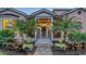 Welcoming entrance with palm trees, brick walkway, and well-lit facade at 1714 Irving St, Sarasota, FL 34236