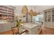 Bright kitchen boasts marble countertops, farmhouse sink, and ample cabinetry at 1714 Irving St, Sarasota, FL 34236