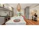 Gourmet kitchen with marble island, stainless steel appliances, and pendant lights at 1714 Irving St, Sarasota, FL 34236