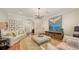 Relaxing living room includes comfortable seating, large TV, and hardwood floors at 1714 Irving St, Sarasota, FL 34236