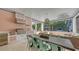 Relaxing outdoor kitchen and dining space with a screened enclosure at 1714 Irving St, Sarasota, FL 34236