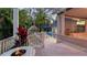 Relaxing patio with fire pit and a view of the pool and garden at 1714 Irving St, Sarasota, FL 34236