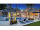 Stunning pool and spa area with lush landscaping and outdoor seating at 1714 Irving St, Sarasota, FL 34236