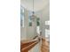 Stunning curved staircase with chandelier and hardwood floors at 1714 Irving St, Sarasota, FL 34236