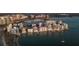 Aerial view of waterfront community with luxury high-rises and marina at 188 Golden Gate Pt # 202, Sarasota, FL 34236