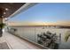 Balcony overlooking the water with sunset view at 188 Golden Gate Pt # 202, Sarasota, FL 34236