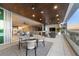 Spacious balcony with outdoor dining furniture and stunning sunset views at 188 Golden Gate Pt # 202, Sarasota, FL 34236