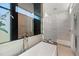 Modern bathroom with freestanding tub and walk-in shower at 188 Golden Gate Pt # 202, Sarasota, FL 34236