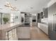 Gourmet kitchen with large island, stainless steel appliances and granite countertops at 188 Golden Gate Pt # 202, Sarasota, FL 34236