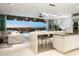 Modern kitchen with large island, stainless steel appliances, and water views at 188 Golden Gate Pt # 202, Sarasota, FL 34236