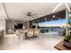 Bright living room with open floor plan and access to a balcony at 188 Golden Gate Pt # 202, Sarasota, FL 34236