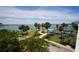 Scenic waterfront park with playground, palm trees, and walking paths at 188 Golden Gate Pt # 202, Sarasota, FL 34236