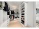Large walk-in closet with ample shelving and drawers at 188 Golden Gate Pt # 202, Sarasota, FL 34236