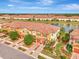 Aerial view of a townhome near a lake at 20223 Lagente Cir, Venice, FL 34293