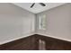 Bedroom with dark hardwood floors and plantation shutters at 2110 Sylvan Lea Dr, Sarasota, FL 34240