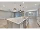 Modern kitchen with white cabinets and expansive quartz countertops at 2110 Sylvan Lea Dr, Sarasota, FL 34240