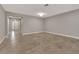 Spacious living area with tile floors and access to entryway at 2110 Sylvan Lea Dr, Sarasota, FL 34240