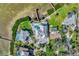 Aerial view of a luxury waterfront home with a private pool and dock at 2287 Bayshore Rd, Nokomis, FL 34275