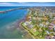 Aerial view of waterfront home with private dock and beautiful landscaping at 2287 Bayshore Rd, Nokomis, FL 34275