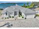 Waterfront home with metal roof, paver driveway, and boat dock at 2287 Bayshore Rd, Nokomis, FL 34275