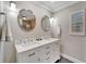 Elegant bathroom with double vanity, large mirrors, and a shower at 2287 Bayshore Rd, Nokomis, FL 34275