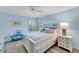 Bedroom with water views and a ceiling fan at 2287 Bayshore Rd, Nokomis, FL 34275
