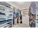 Spacious walk-in closet with ample shelving and drawers at 2287 Bayshore Rd, Nokomis, FL 34275