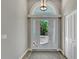 Bright entryway with hardwood floors and arched window at 2287 Bayshore Rd, Nokomis, FL 34275