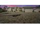 Stunning waterfront home exterior at dusk, featuring a large driveway at 2287 Bayshore Rd, Nokomis, FL 34275