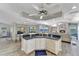 Open concept kitchen with large island, white cabinets, and water views at 2287 Bayshore Rd, Nokomis, FL 34275