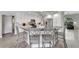 Modern kitchen with a large island, white cabinets, and gray countertops at 2287 Bayshore Rd, Nokomis, FL 34275