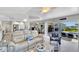 Open concept living room with water views and kitchen access at 2287 Bayshore Rd, Nokomis, FL 34275