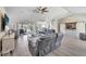 Spacious living room with vaulted ceilings, reclining sofas, and water views at 2287 Bayshore Rd, Nokomis, FL 34275