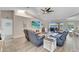 Relaxing living room with hardwood floors, a large TV, and water views at 2287 Bayshore Rd, Nokomis, FL 34275