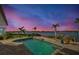 Relaxing waterfront pool at sunset with gorgeous views at 2287 Bayshore Rd, Nokomis, FL 34275