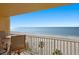 Oceanfront balcony with table and chairs at 4311 Gulf Of Mexico Dr # 501, Longboat Key, FL 34228