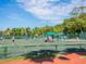 Active adults enjoying tennis on sunny courts at 4311 Gulf Of Mexico Dr # 501, Longboat Key, FL 34228