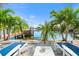 Relaxing patio with lounge chairs overlooking the water at 445 115Th Ave, Treasure Island, FL 33706