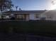 Front view of a ranch home with a carport and lawn at 4514 103Rd W St, Bradenton, FL 34210