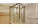 Corner shower with tiled walls and glass enclosure at 4825 Gulf Of Mexico Dr # 304, Longboat Key, FL 34228