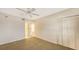 Bright bedroom with ample closet space and neutral carpeting at 4825 Gulf Of Mexico Dr # 304, Longboat Key, FL 34228