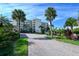Front view of the building, showing landscaping and parking at 4825 Gulf Of Mexico Dr # 304, Longboat Key, FL 34228