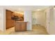 Well-equipped kitchen with wood cabinets and granite counters at 4825 Gulf Of Mexico Dr # 304, Longboat Key, FL 34228