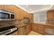 Modern kitchen features granite countertops and stainless steel appliances at 4825 Gulf Of Mexico Dr # 304, Longboat Key, FL 34228