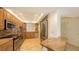 Modern kitchen with stainless steel appliances and wood cabinets at 4825 Gulf Of Mexico Dr # 304, Longboat Key, FL 34228