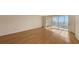 Living room with hardwood floors and sliding doors at 4825 Gulf Of Mexico Dr # 304, Longboat Key, FL 34228