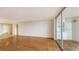 Bright living room with hardwood floors and access to a balcony at 4825 Gulf Of Mexico Dr # 304, Longboat Key, FL 34228