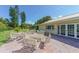 Community patio with tables and chairs at 4825 Gulf Of Mexico Dr # 304, Longboat Key, FL 34228