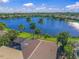 Property showcasing lake view and pool area at 518 Luminary Blvd, Osprey, FL 34229